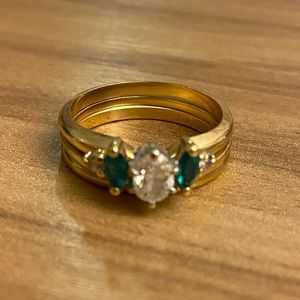 14k gold 3 piece diamond wedding set with emerald setting.